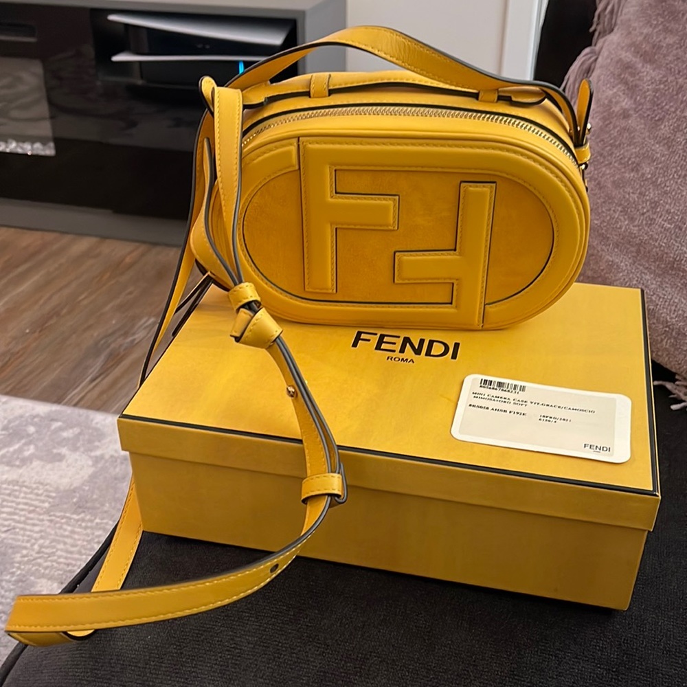FENDI o’lock camera yellow cross body bag with removable strap.